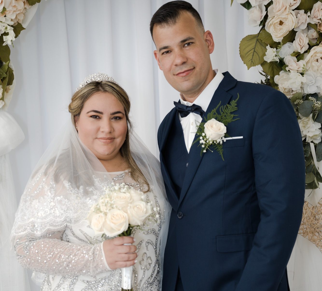 Ceremony Suite - Wedding Day Romance Bride and Groom posting with Wedding Arch