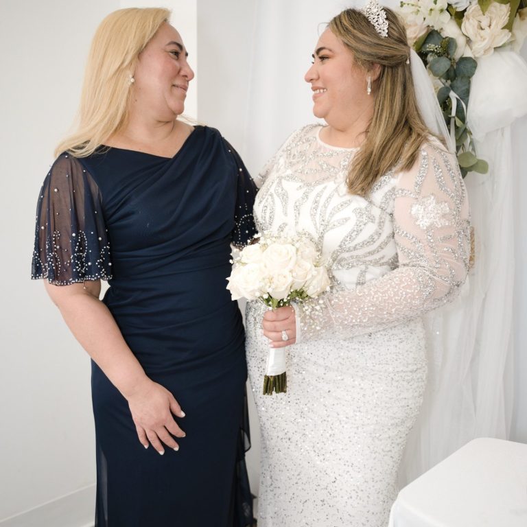 Mother of the bride & bride  posing at Wedding Day Romance in Pinecrest Florida