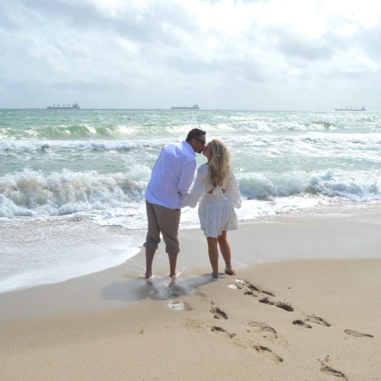 Newlyweds showing off their wedding rings