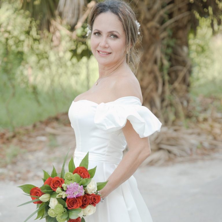 Bride holding a bouquet by Wedding Day Romance in Miami Florida 