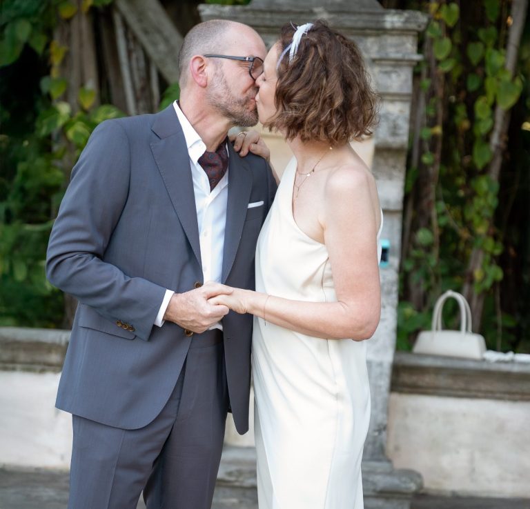 Newlyweds showing off their wedding rings
