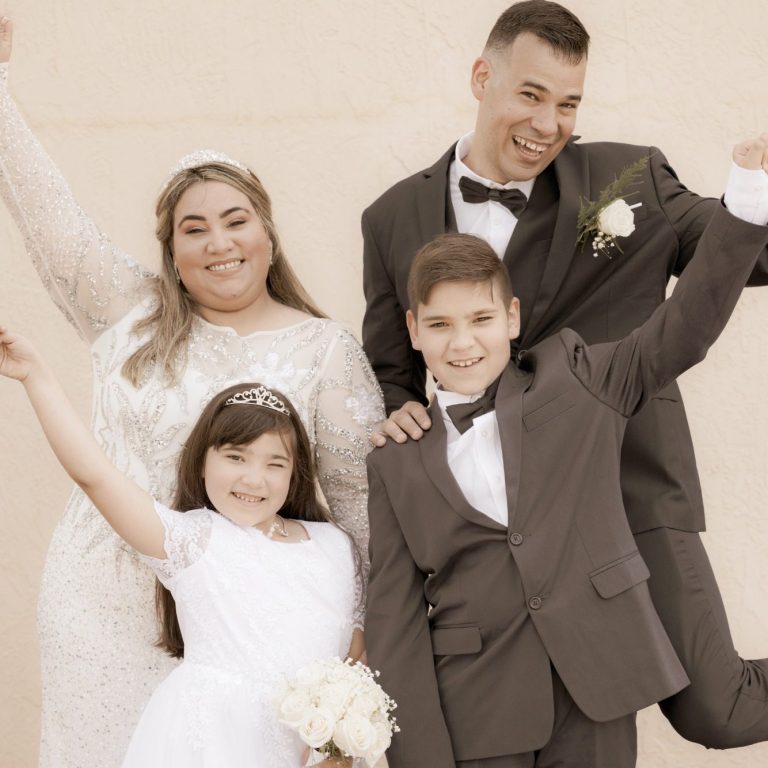 A new family celebrating together after their wedding officiated by Iris Ramil from Wedding Day Romance