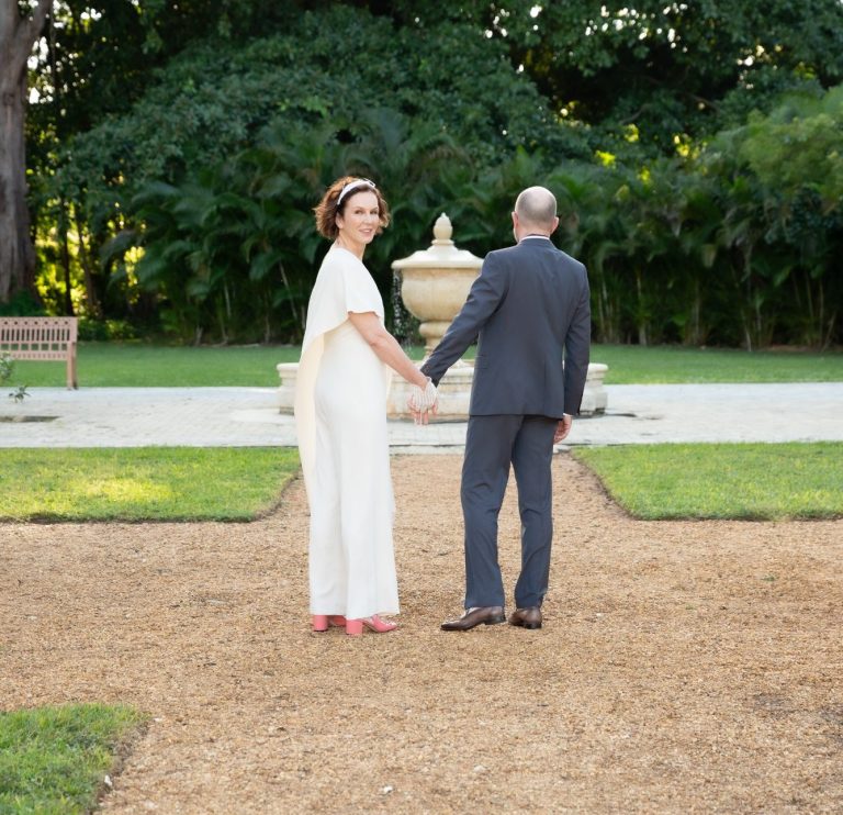 Bride & Groom posing after being married by wedding officiant Iris Ramil